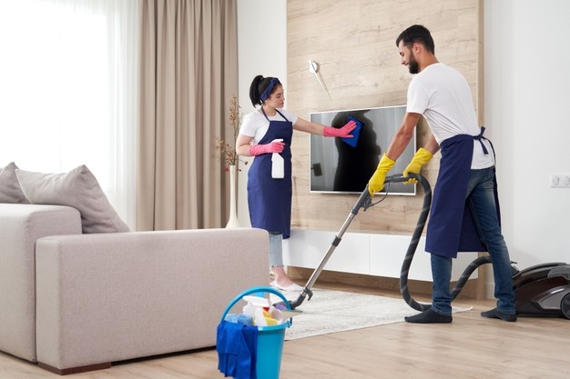 a group of professionals sprucing up a property