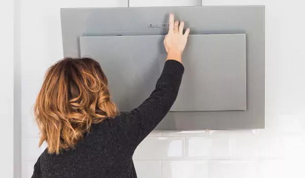 woman opening the kitchen hood