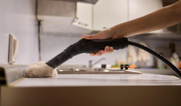 Achieving efficient and thorough cleaning with a steam cleaner in a modern kitchen setting