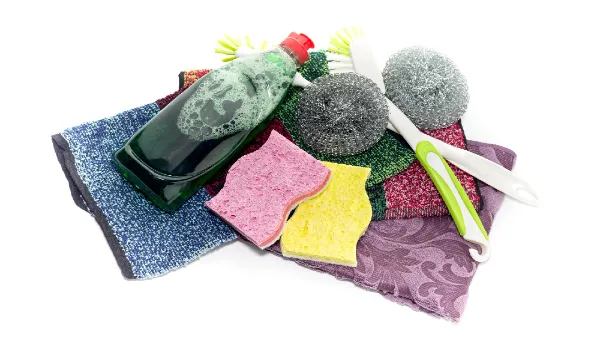 Detergent and washcloths on a white background