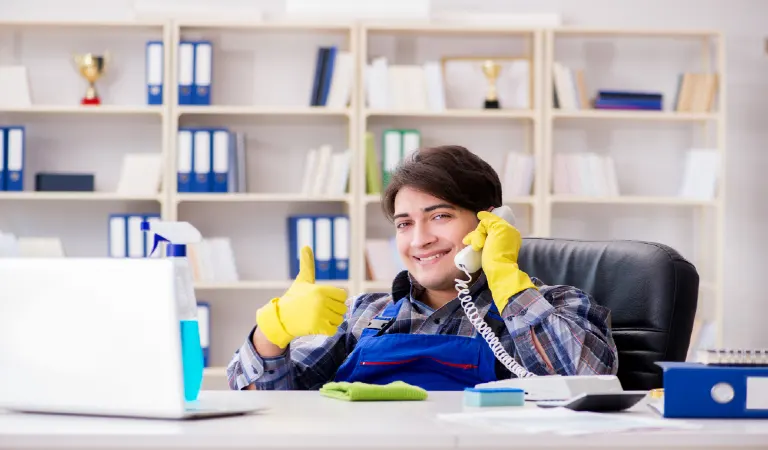 Male cleaner working in the office