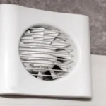The fan is built into the wall in the kitchen