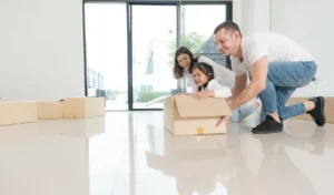 Happy family with girl moving into a new home