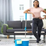 home clean. Full length portrait of young woman posing with a mop while cleaning her home