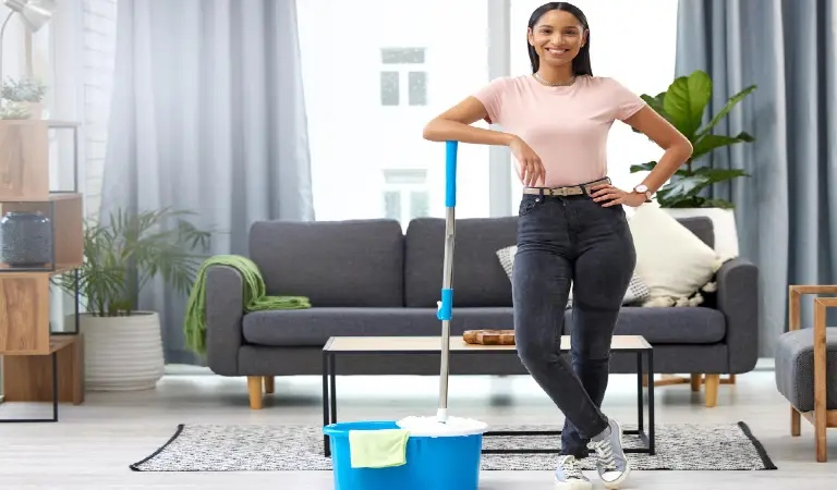 home clean. Full length portrait of young woman posing with a mop while cleaning her home