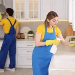 Professional janitors working in kitchen cleaning service
